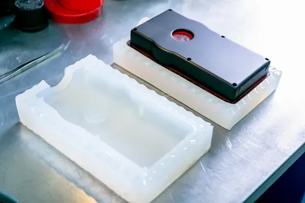 Vacuum cast soft-touch grip, assembled with the rigid body sub-assembly.
